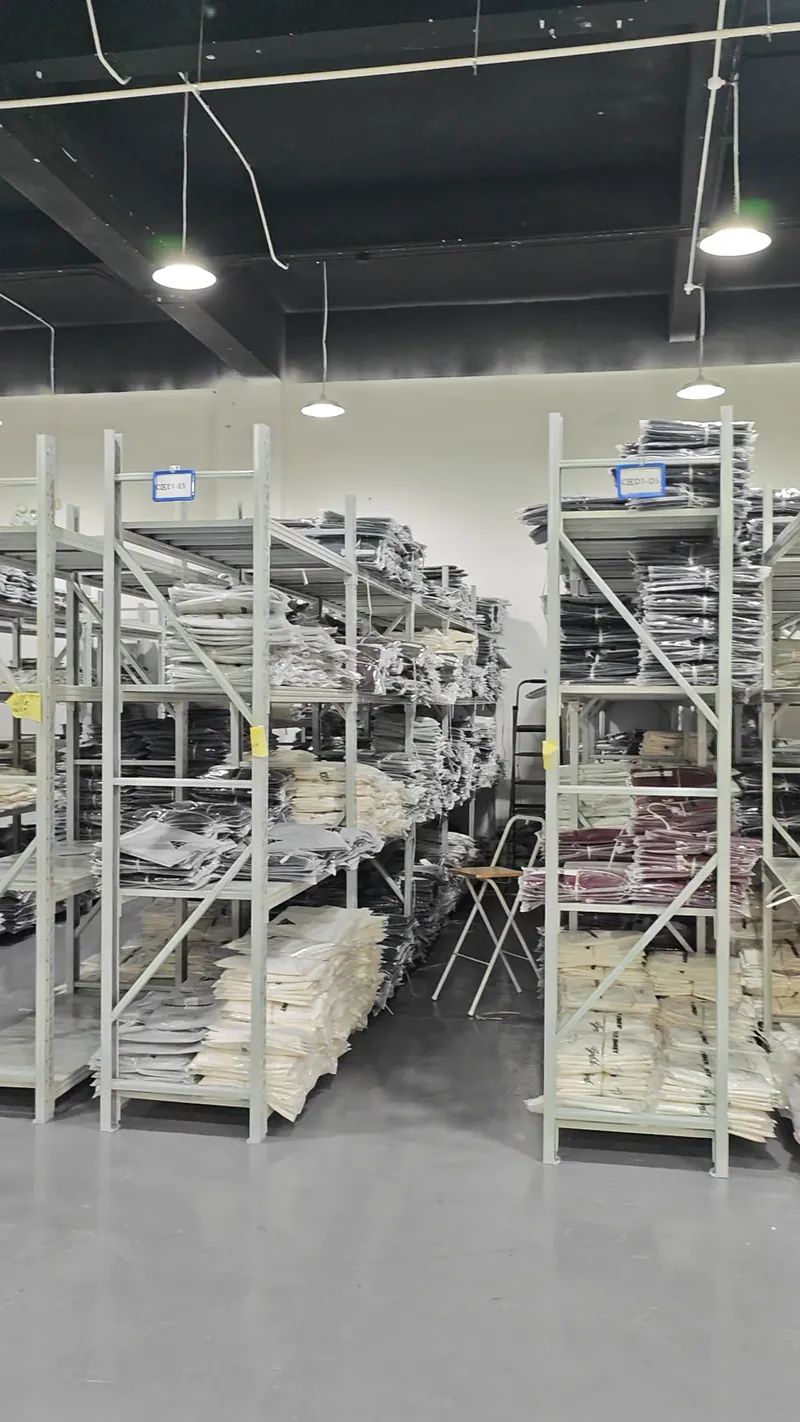 Garments stored on warehouse shelving